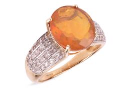 A fire opal dress ring, the oval-shaped fire opal, weighing approximately 2.36cts, the tapered shoul
