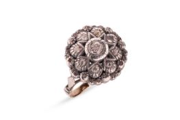 A diamond cluster ring, of starburst design, set with old-cuts and edged by a border of rose-cut dia
