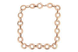 A fancy link bracelet in 9ct yellow gold, comprising a series of circular links of twisted rope desi