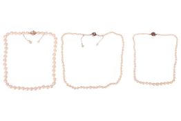 Three cultured pearl necklaces, each with a gem-set clasp marked '9ct', measuring 42cm, 48cm and 38c