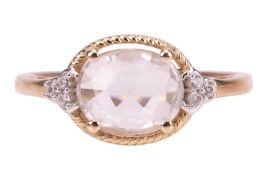 A synthetic sapphire ring, featuring a central oval rose-cut synthetic colourless sapphire, claw-set