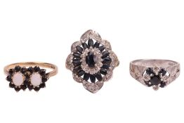 Three gem-set dress rings, each of cluster form; The first featuring two oval cabochon white opals e