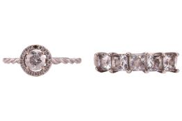 A diamond halo ring, together with a CZ half-hoop ring; the halo ring centred with a round brilliant