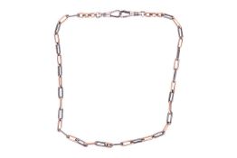 A Continental Niello watch chain, terminated with double dog clips, stamped ‘900’, overall length 39