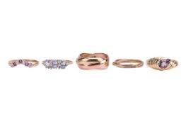 Five rings; The first an amethyst and cubic zirconia seven stone wishbone ring, to a 9ct gold ring s