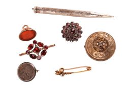 A mixed group of items comprising a garnet-set cluster brooch, in yellow metal stamped '9c', togethe