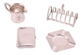 A silver six-bar lancet shaped toast rack, Birmingham 1927, a silver curved rectangular cigarette ca