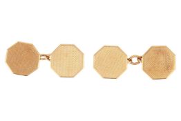 A pair of hexagonal cufflinks in 9ct gold, the panels with engine-turned patterns, connected with ca