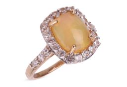 An opal and diamond cluster ring, the cushion-shaped cabochon opal, weighing approximately 1.58cts, 
