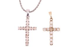 A pendant on chain and an additional pendant; The pendant on chain of cross form, claw-set with roun