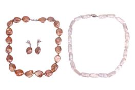 A baroque dyed pearl necklace with magnetic clasp, together with a pair of matching drop earrings, i