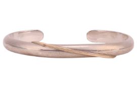 A silver open cuff bangle, with a swirl detail, Edinburgh assay marks, maker's mark 'N Mc A', inner 