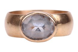 A synthetic spinel dress ring in 9ct gold, collet-set to a wide band, British assay marks, size R, 6