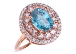 A gem-set cluster ring in 9ct gold, the central oval-shaped zircon, weighing approximately 3.25cts, 