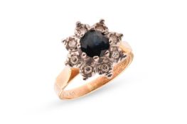 A diamond and sapphire cluster ring, featuring a round-cut dark blue sapphire measuring 5.95mm x 5.9