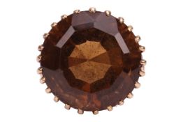 A smoky quartz cocktail ring, contains a circular-cut smoky quartz of 18.0 mm, in a wire claw mount 