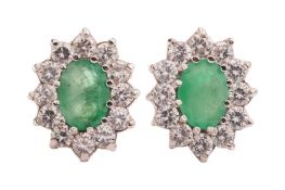A pair of emerald-set cluster earrings, claw-set with oval mixed-cut emeralds measuring approximatel