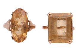 Two citrine dress rings; to include a rectangular step-cut citrine claw-set in yellow metal marked '