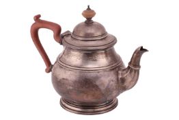 A silver teapot by Adie Brothers Ltd, Birmingham 1951, of baluster form with reeded girdle, on a fla