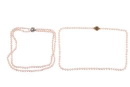 Two cultured pearl necklaces; to include a double-strand pearl necklace, with round pearls of 7.0-7.