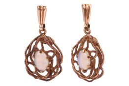 A pair of opal drop earrings in 9ct yellow gold, of abstract and textured bird nest form, centred wi