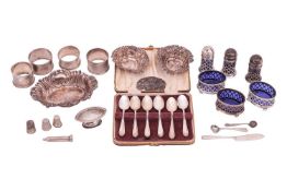 A collection of silver items comprising, a pair of embossed heart shaped bon-bon dishes, Chester 189