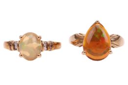 Two 9ct gold Ethiopian water opal rings; one set with an oval cabochon, size P; the other claw-set w