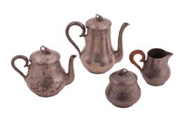A German Jugendstil four-piece pewter teaset by Kayserzinn, comprising a coffee pot, a teapot, a cre