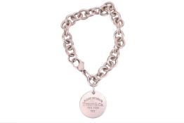 Tiffany & Co. - A 'Return to Tiffany' disc bracelet, comprising a series of cable links, suspend