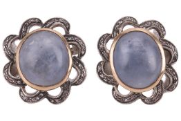 A pair of sapphire and diamond earrings, each set with cabochon blue sapphires in a rub over setting