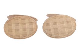 A pair of cufflinks, the oval panels with engraved gingham and stripe patterns, with whale tail fitt