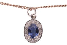 A sapphire and diamond pendant and chain, the pendant stamped '375', the chain a flat curb link, sta