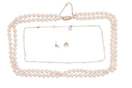 A group lot of cultured pearls and a faux pearl necklace; The faux pearl necklace featuring two stra