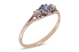 A sapphire and diamond set ring, featuring a central round cut sapphire of pale blue colour, measuri
