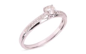 A diamond solitaire ring, featuring a central claw-set round brilliant-cut diamond of extimated 0.23