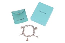 Tiffany & Co. - A 'Party' charm bracelet, featuring a cable-link chain stamped 'T&Co. 925', 