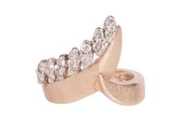 A diamond-set dress ring, featuring a band of crossover design, with crosshatch finish, highlighted 