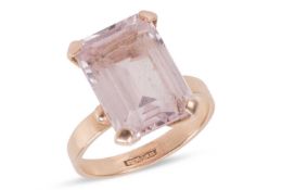 A pink synthetic spinel ring, centrally-set with a step-cut pale pink synthetic spinel, claw-set in 