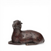 China, a bronze figure of a reclining deer, 18th century or later,
