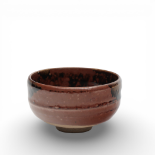 Japan, a russet- and brown-glazed earthenware teabowl, chawan, 20th century,