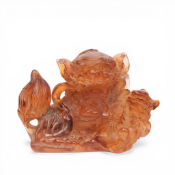 China, an amber carving of a buddhist lion, 19th century,