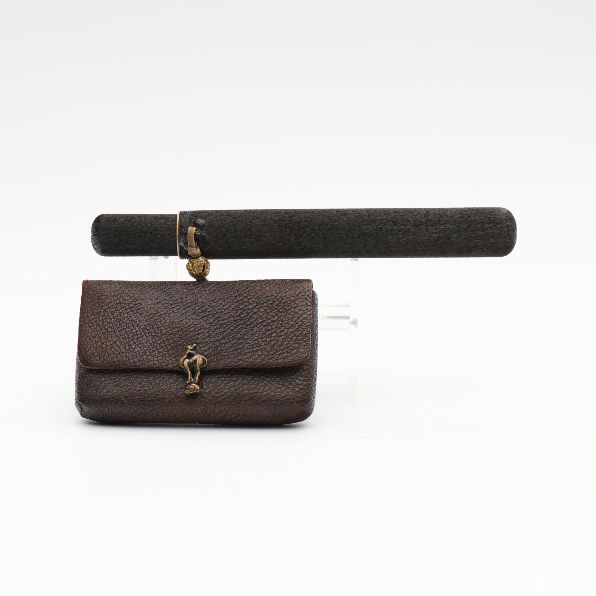 Japan, a tobacco pouch with lacquered-wood pipe case, Meiji period (1868-1912),