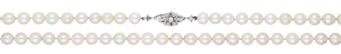 A cultured pearl necklace, the uniform row of cultured pearls to a pierced clasp set with...