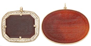 Two carved agate pendants, the first a collet-set carnelian oval plaque with carved Islamic...