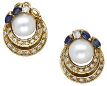 A pair of gem-set ear clips, each centred with a cultured pearl above two crescents set...