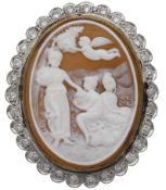 A shell cameo and diamond brooch / pendant, depicting three maidens beneath a putto, within...