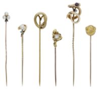 Six antique stickpins, to include three serpent examples and a gold nugget set with a rough...