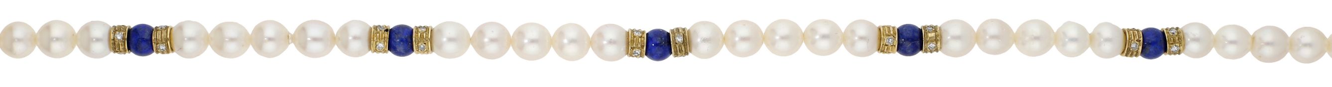 A cultured pearl and gem-set necklace, the cultured pearls spaced by lapis lazuli beads...