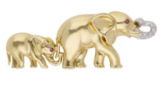 A novelty elephant brooch, the mother elephant with raised diamond-set trunk, the calf...