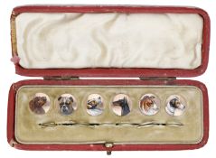 An early 20th century set of enamel studs, the six circular plaques each depicting a...